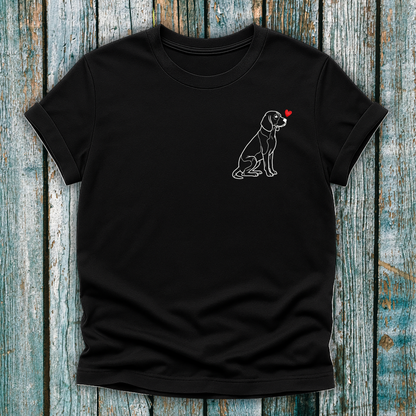 Black t-shirt with a beagle dog graphic and a love heart on a wooden surface