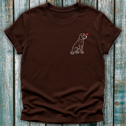 Brown t-shirt with a beagle dog graphic and a love heart on a wooden surface